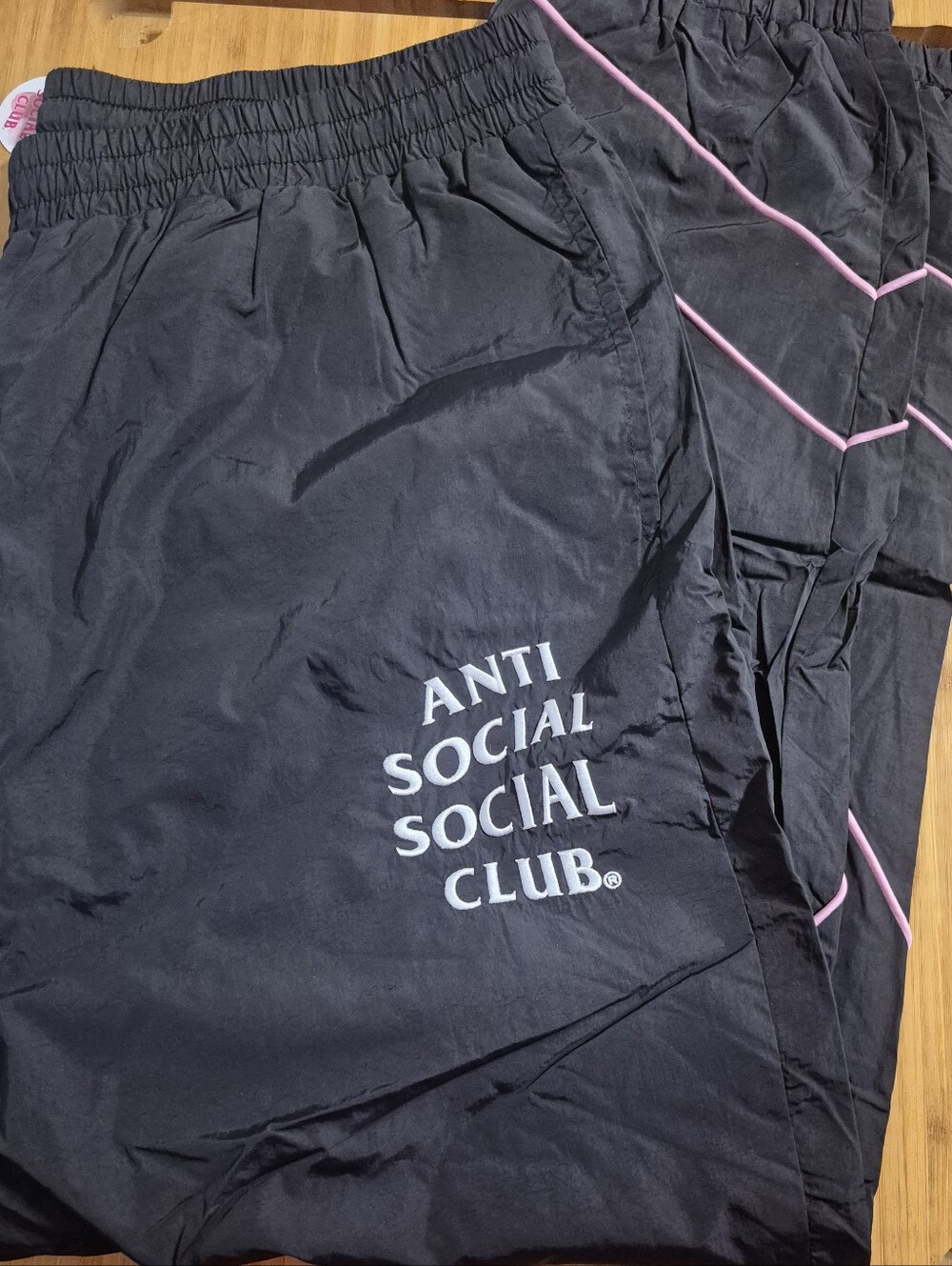 Anti Social Social Club Black Track Pants with Pink Piping and White Logo